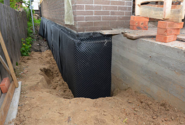 SJ Waterproofing Pros technician performing targeted Basement Waterproofing assessment in Fayette, OH
